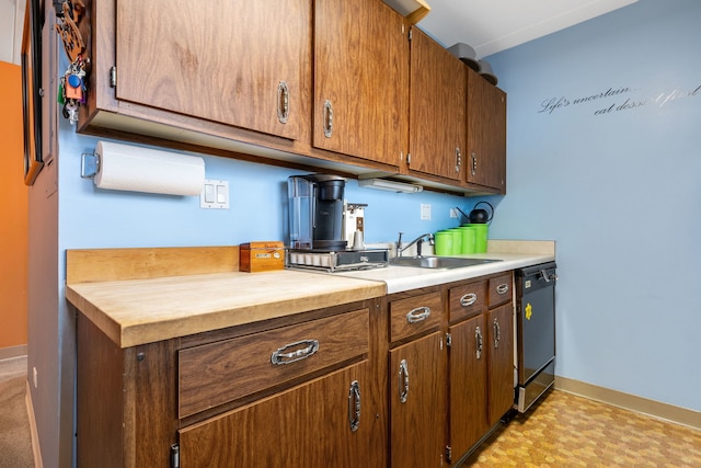 330 W Miner St Unit 1B, Arlington Heights, IL 60005 - kitchen with dishwashing machine, baseboards, a sink, and wooden counters