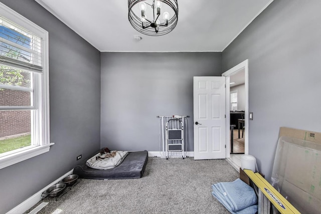 1325 Lincoln St, North Chicago, IL 60064 - carpeted bedroom featuring a chandelier and baseboards