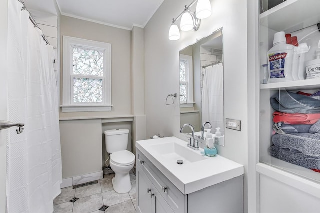 1325 Lincoln St, North Chicago, IL 60064 - bathroom featuring crown molding, vanity, toilet, and tile patterned flooring