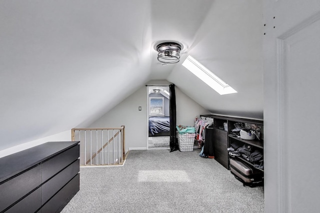 1325 Lincoln St, North Chicago, IL 60064 - spacious closet featuring a skylight, lofted ceiling, and carpet floors