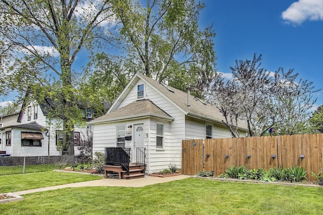 1325 Lincoln St, North Chicago, IL 60064 - back of property featuring a shingled roof