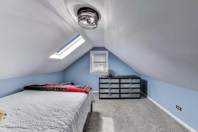 1325 Lincoln St, North Chicago, IL 60064 - bedroom with a skylight, lofted ceiling, carpet floors, and baseboards