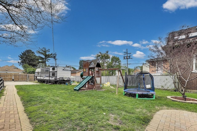 1325 Lincoln St, North Chicago, IL 60064 - view of yard with a trampoline and a playground