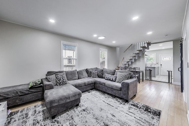 1325 Lincoln St, North Chicago, IL 60064 - living room with stairway, recessed lighting, healthy amount of natural light, and light wood finished floors