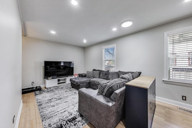 1325 Lincoln St, North Chicago, IL 60064 - living area with light wood-style flooring, baseboards, and recessed lighting