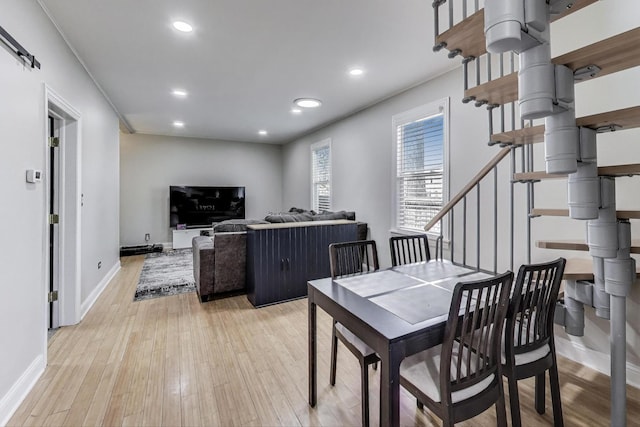 1325 Lincoln St, North Chicago, IL 60064 - dining room featuring light wood-style floors, baseboards, recessed lighting, and stairway