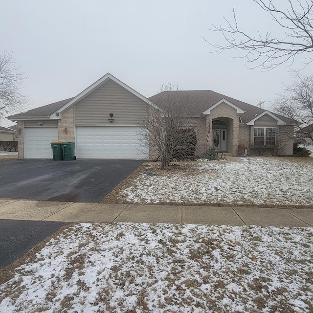 21526 Trick Circle Ct, Wilmington, IL 60481 - single story home featuring brick siding, an attached garage, driveway, and a shingled roof