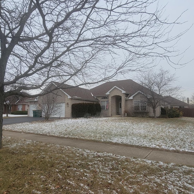 21526 Trick Circle Ct, Wilmington, IL 60481 - ranch-style home with an attached garage, driveway, brick siding, and roof with shingles