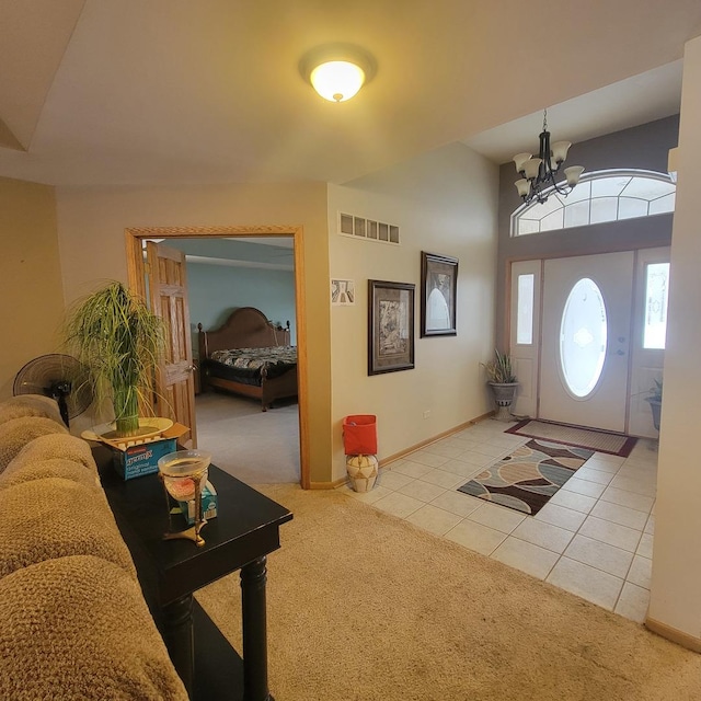 21526 Trick Circle Ct, Wilmington, IL 60481 - entryway with visible vents, light tile patterned floors, baseboards, a chandelier, and light colored carpet