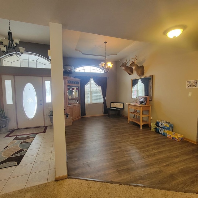 21526 Trick Circle Ct, Wilmington, IL 60481 - entrance foyer with an inviting chandelier, a tray ceiling, and a wealth of natural light