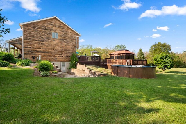 41W838 High Point Ln, Elburn, IL 60119 - view of grassy yard with a gazebo, a deck, and an outdoor pool