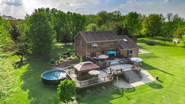 41W838 High Point Ln, Elburn, IL 60119 - back of property with a deck, a gazebo, a chimney, a lawn, and a forest view