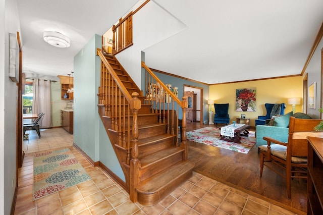41W838 High Point Ln, Elburn, IL 60119 - stairway featuring tile patterned floors, baseboards, and crown molding