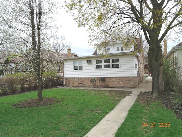 5837 N Navarre Ave, Chicago, IL 60631 - back of property featuring brick siding, a lawn, and a chimney