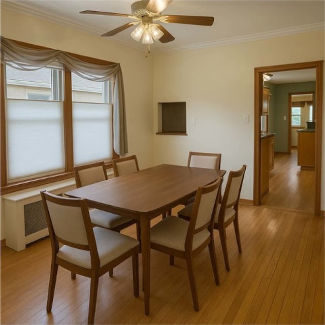 5837 N Navarre Ave, Chicago, IL 60631 - empty room with radiator heating unit, ceiling fan, crown molding, wood finished floors, and baseboards