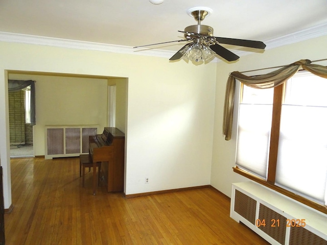 5837 N Navarre Ave, Chicago, IL 60631 - kitchen with appliances with stainless steel finishes, light wood-style floors, wallpapered walls, a ceiling fan, and a sink