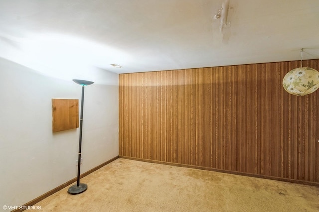 unfurnished room with light carpet