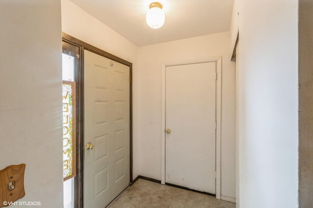 foyer entrance with light carpet