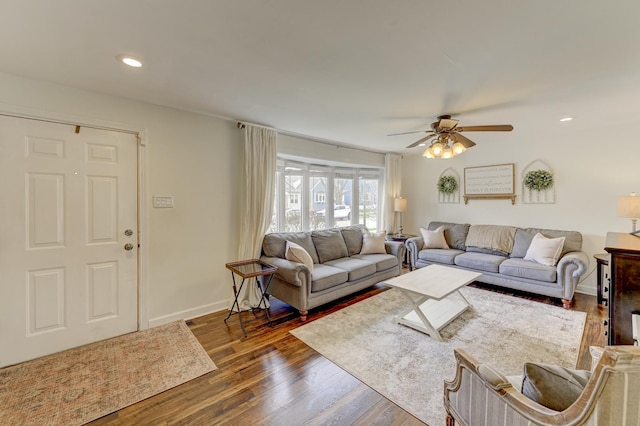 living area with ceiling fan, baseboards, dark wood-style flooring, and recessed lighting