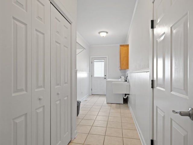 3035 Rollingridge Rd, Naperville, IL 60564 - laundry room with baseboards, ornamental molding, cabinet space, and light tile patterned floors