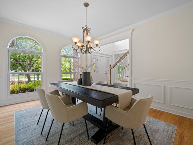 3035 Rollingridge Rd, Naperville, IL 60564 - dining space with an inviting chandelier, crown molding, wainscoting, a decorative wall, and stairway