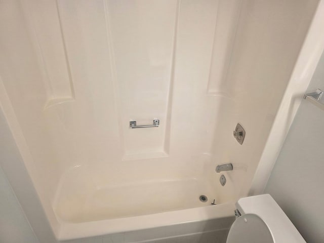 full bathroom featuring toilet and washtub / shower combination