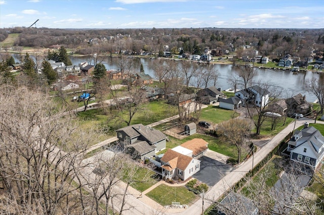 drone / aerial view with a residential view and a water view