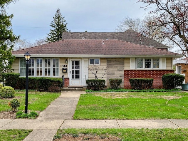 15W561 Victory Pkwy, Elmhurst, IL 60126 - view of front of property featuring a front yard, brick siding, and roof with shingles