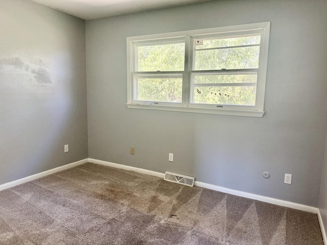 748 Marcy St, Ottawa, IL 61350 - unfurnished room with baseboards, carpet flooring, and visible vents