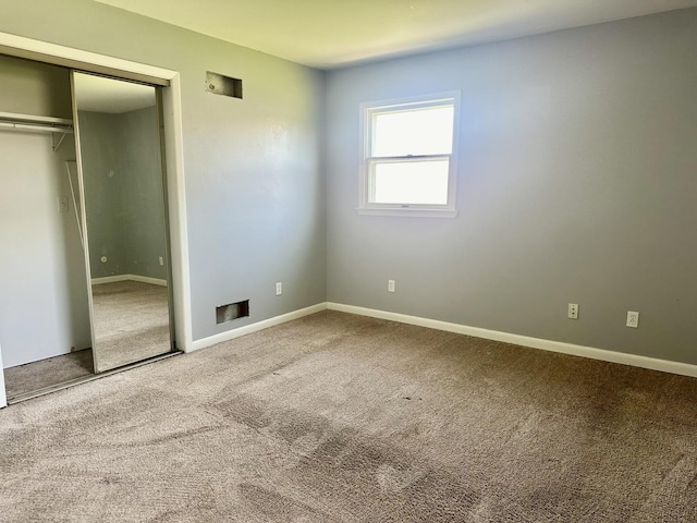 748 Marcy St, Ottawa, IL 61350 - unfurnished bedroom featuring baseboards, carpet flooring, and a closet
