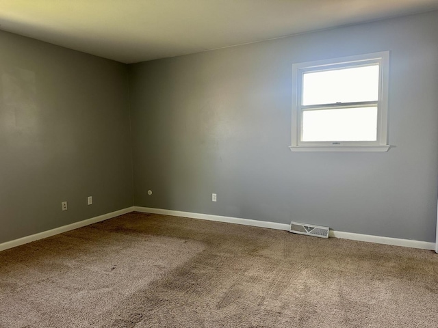 748 Marcy St, Ottawa, IL 61350 - carpeted empty room with baseboards and visible vents