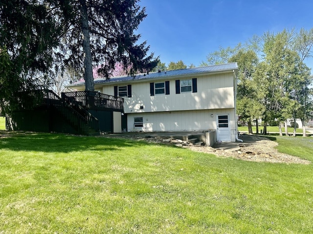 748 Marcy St, Ottawa, IL 61350 - back of house with a yard, stairs, metal roof, and a deck