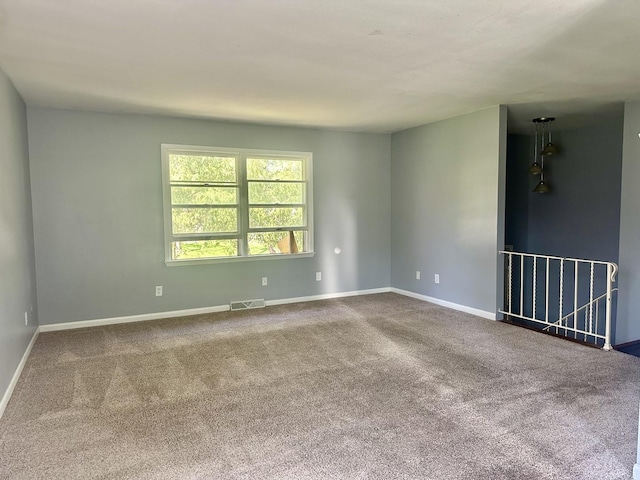 748 Marcy St, Ottawa, IL 61350 - unfurnished room with carpet floors, visible vents, and baseboards