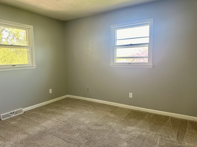 748 Marcy St, Ottawa, IL 61350 - carpeted spare room featuring baseboards and visible vents