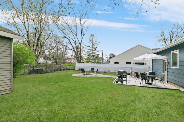 view of yard with fence and a patio
