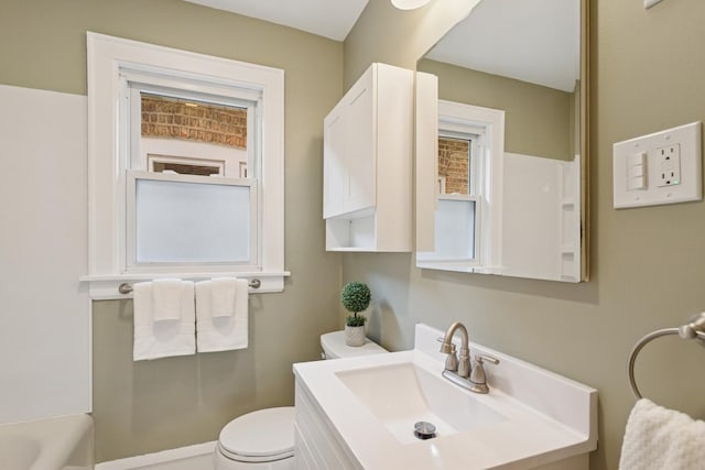 bathroom with toilet and vanity