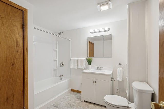 full bath featuring vanity, baseboards, bathtub / shower combination, and toilet
