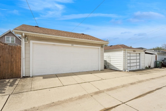 detached garage with fence