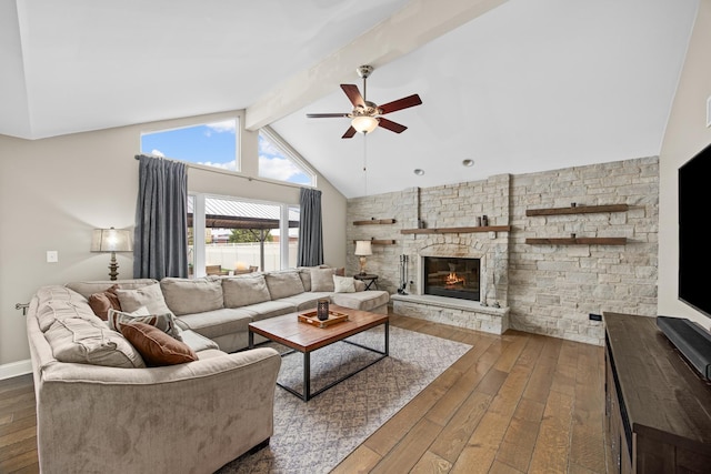 living room featuring a fireplace, a ceiling fan, lofted ceiling with beams, and hardwood / wood-style floors