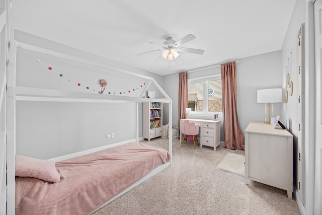 carpeted bedroom with baseboards and ceiling fan