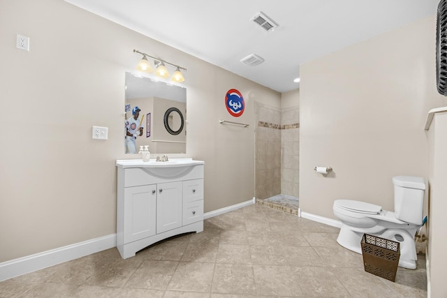 bathroom with visible vents, vanity, toilet, baseboards, and walk in shower