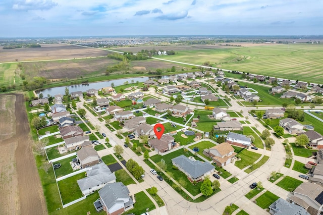 bird's eye view with a water view and a residential view
