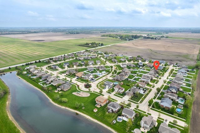 birds eye view of property with a residential view, a water view, and a rural view