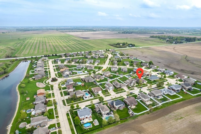 bird's eye view featuring a water view, a rural view, and a residential view