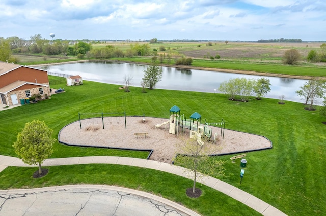 surrounding community featuring a lawn, a water view, and playground community