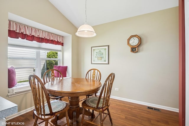 184 Stillwater Dr, Hainesville, IL 60030 - dining space with baseboards, vaulted ceiling, and wood finished floors