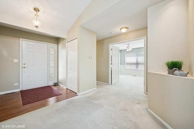184 Stillwater Dr, Hainesville, IL 60030 - foyer entrance featuring carpet flooring, baseboards, and ceiling fan