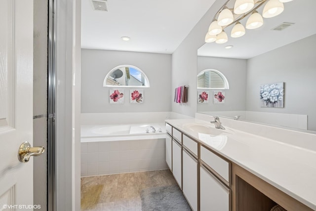 184 Stillwater Dr, Hainesville, IL 60030 - full bathroom with vanity, a bath, and tile patterned floors