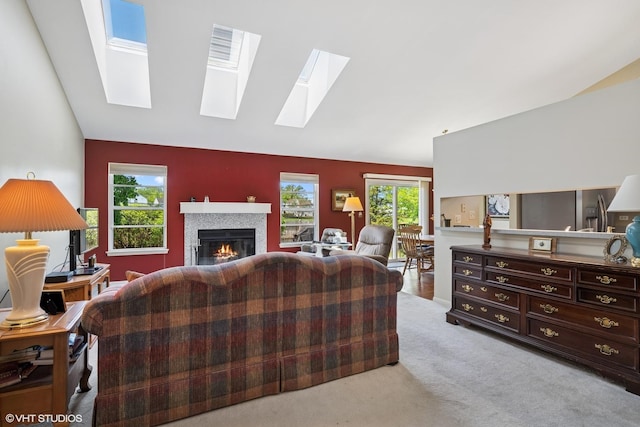184 Stillwater Dr, Hainesville, IL 60030 - carpeted living area with a skylight, vaulted ceiling, and a glass covered fireplace
