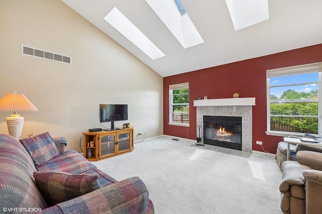 184 Stillwater Dr, Hainesville, IL 60030 - carpeted living area with high vaulted ceiling, a high end fireplace, and a skylight